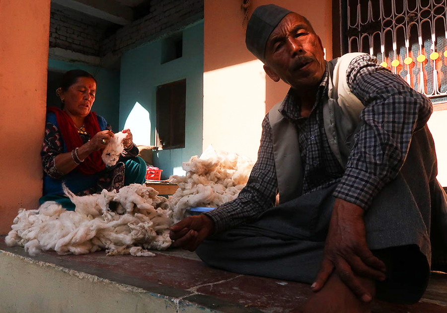 processing wool to make handmade wool shawl