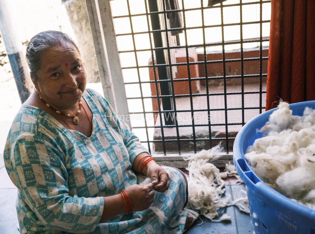 Working with wool in Dunda to make wool shawl